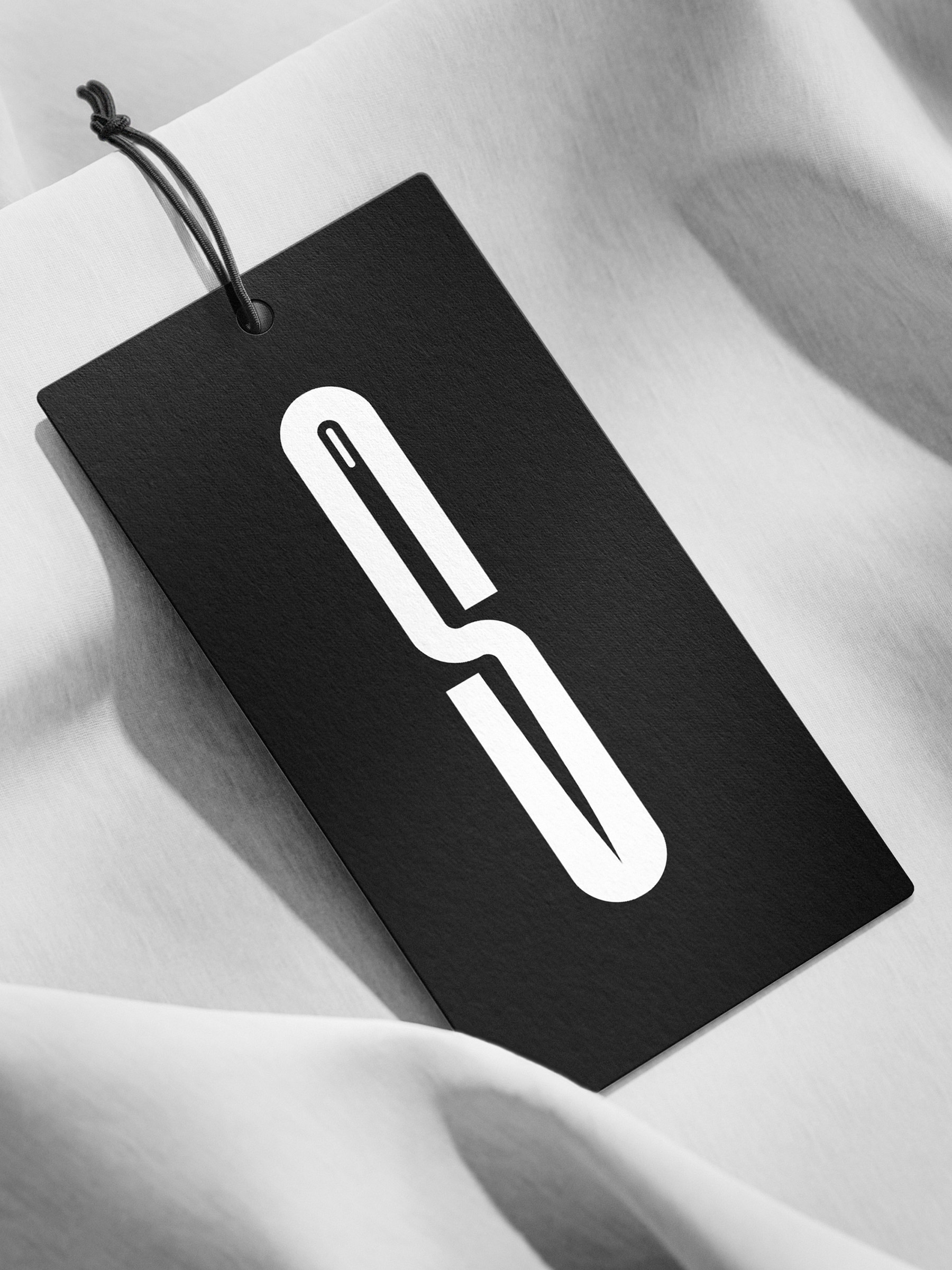 Krzysztof Guzek Designs Spod Igły With a Clean Visual System and High-Impact Brand Consistency